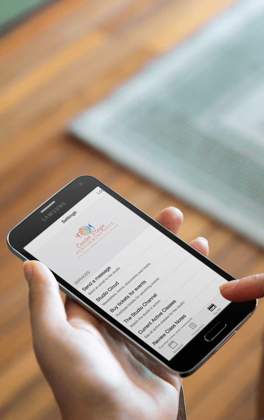 Someone using a studio mobile app created with Studio Pro to review current class registration